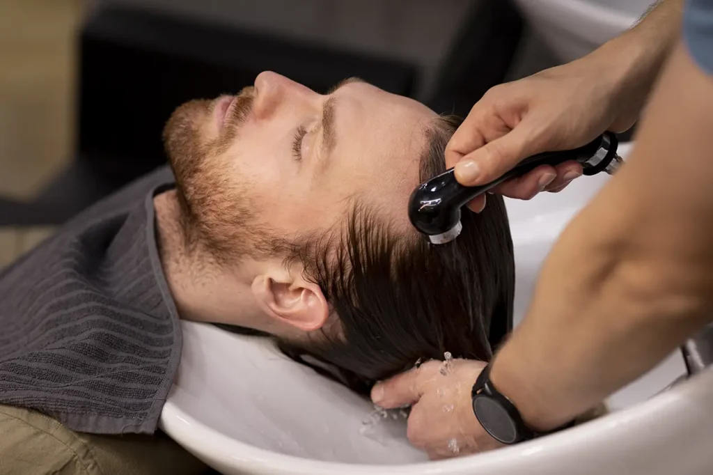 ছেলেদের চুলের যত্নের সহজ উপায় 7 hairdresser grooming their client