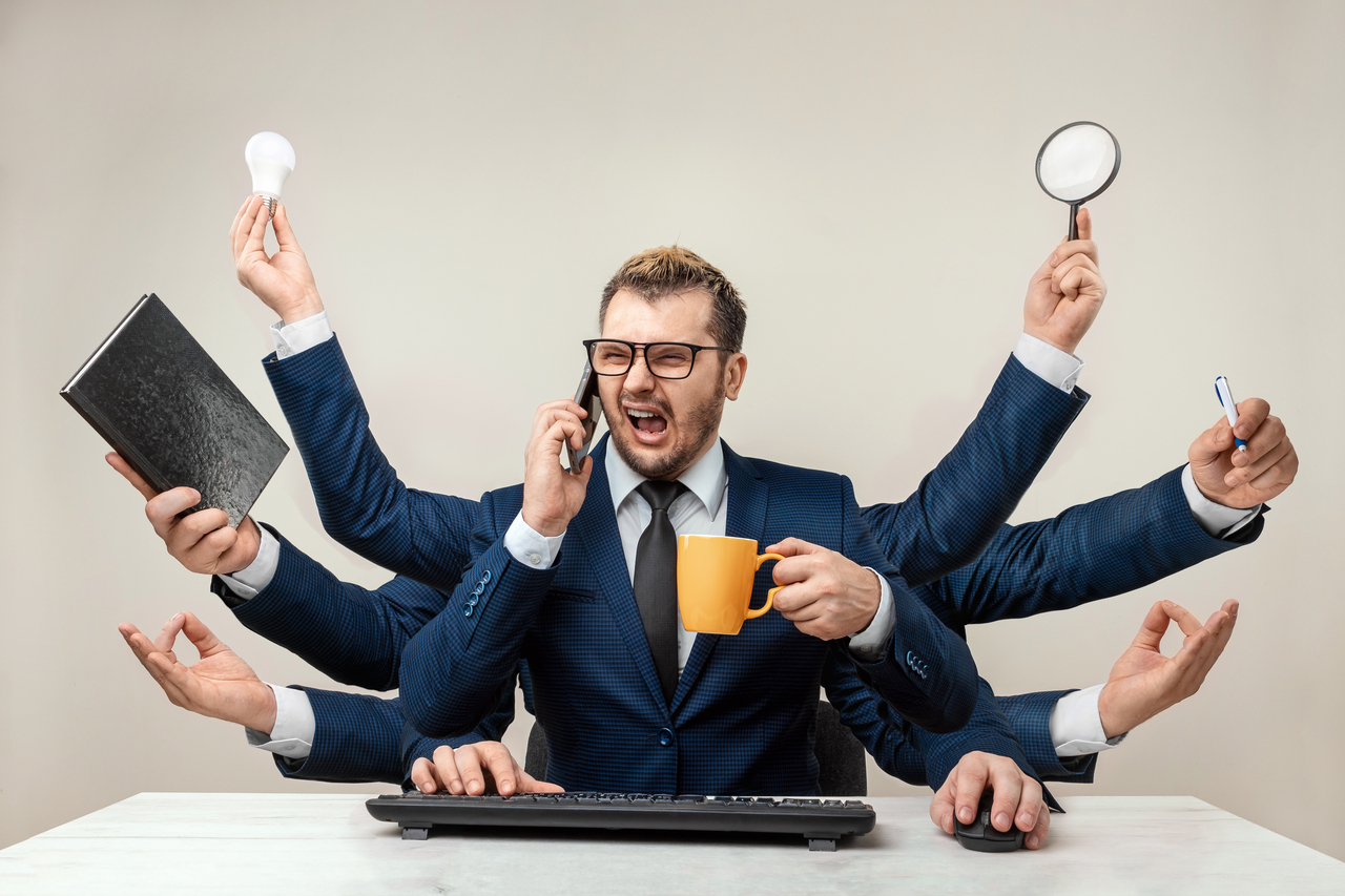 মাল্টিটাস্কিং আসলে কতটা ভালো? 8 businessman with many hands suit